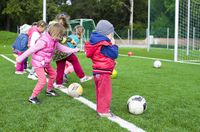 kids-playing-football-summer-camp.jpeg