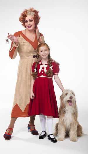 ANNIE - Craig Revel Horwood as Miss Hannigan with Annie and Sandy - Photo credit Hugo Glendinning.jpg