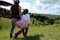 Family flying a kite at Box Hill, Surrey.